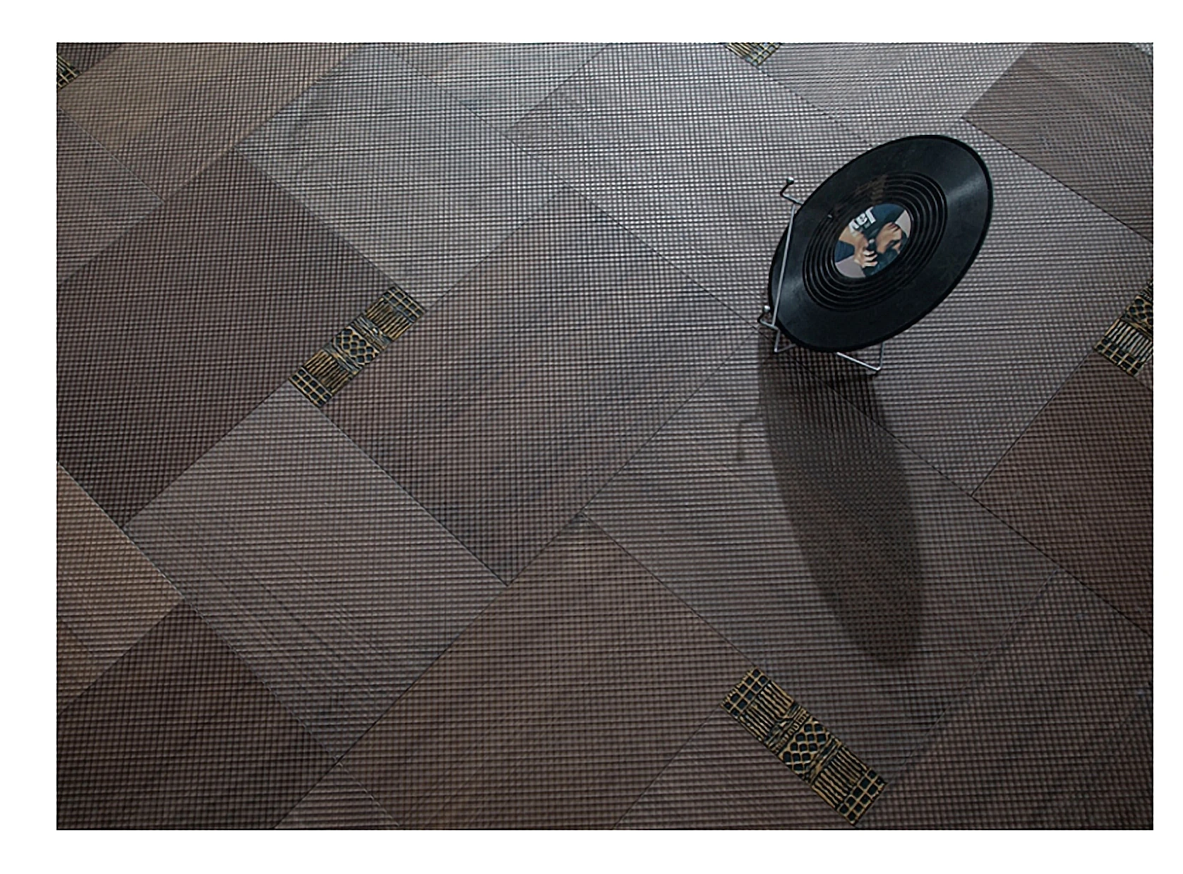 PARBRO MY-7502 — Walnut + solid brass inlay wood grain close-up detail. Art wood flooring from China, sourced through Tarmeer's Dubai material selection center.
